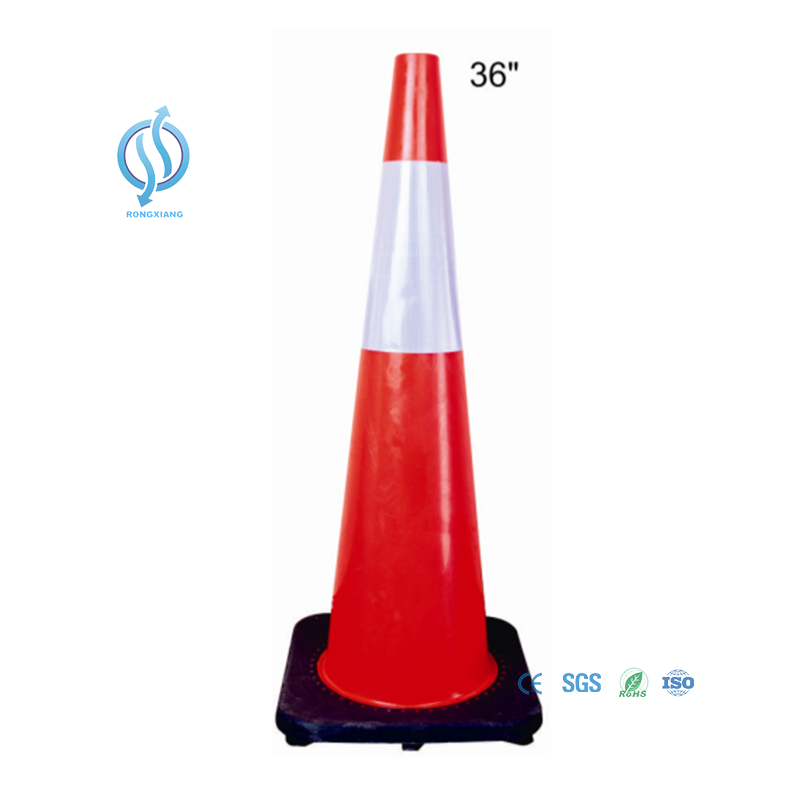 Reflective orange traffic cone on road